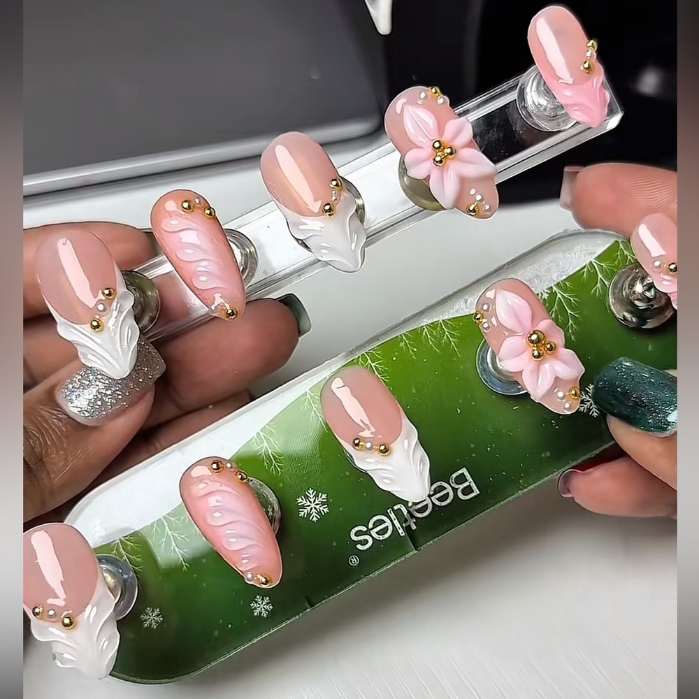 Beetles Nail Art Display with Pink and White Designs